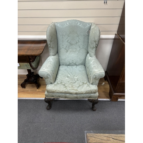 193 - An early 20th century George III style upholstered wing armchair, width 82cm, depth 74cm, height 110... 