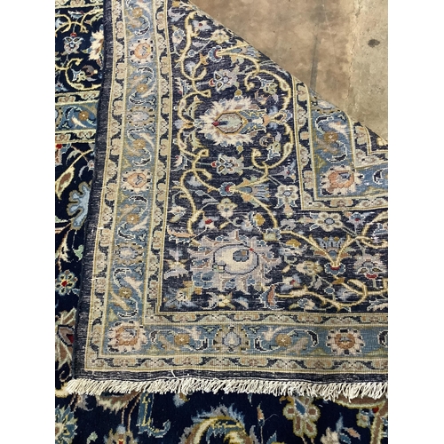 197 - A North West Persian blue ground carpet, 344 x 276cm