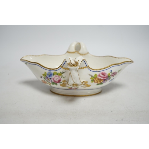 261 - An 18th century Sevres sauceboat, probably later enamelled with flowers, 23.5cm wide