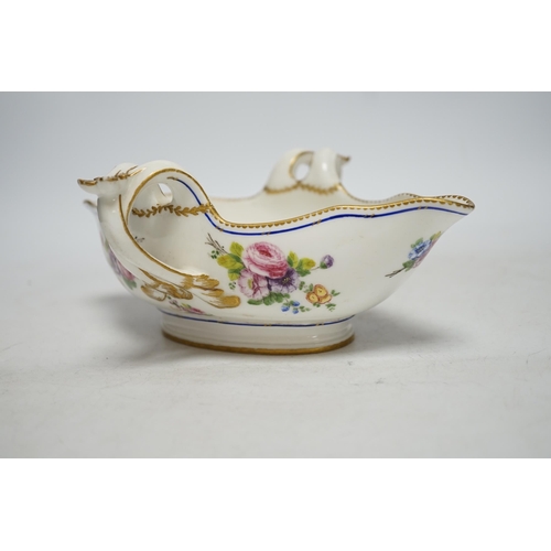 261 - An 18th century Sevres sauceboat, probably later enamelled with flowers, 23.5cm wide