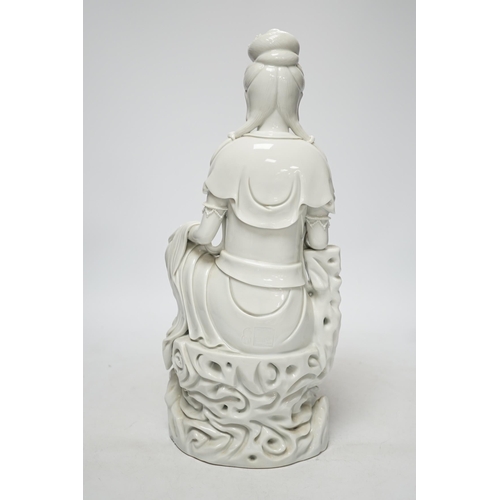 270 - A late 19th / early 20th century Chinese blanc de Chine seated figure of Guanyin, impressed mark to ... 