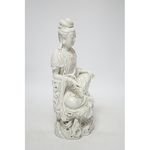 270 - A late 19th / early 20th century Chinese blanc de Chine seated figure of Guanyin, impressed mark to ... 