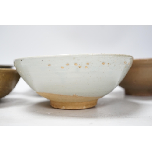 272 - A group of four Chinese Longquan or Yue ware celadon bowls and a Qingbai bowl, Song-Yuan dynasty, la... 