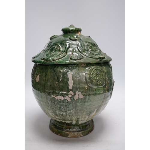 278 - A Chinese Buddhist green glazed jar and cover, Song-Yuan dynasty, 33cm