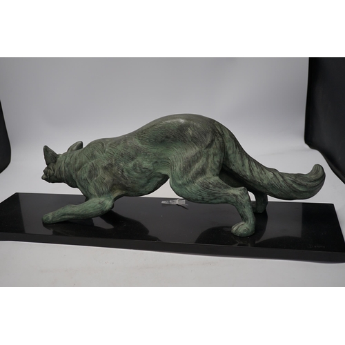 284 - A bronzed metal model of a stalking fox, on black marble plinth, 62cm