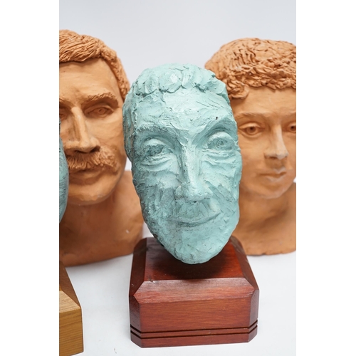 290 - Four art pottery sculpted heads on stands, two terracotta and two painted verdigris green, largest 3... 