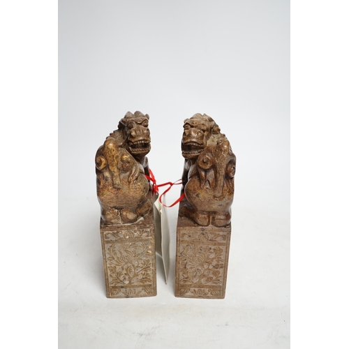 317 - A pair of Chinese soapstone lion-dog and cub seals, 19cm high