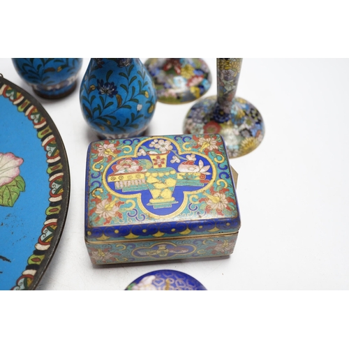 325 - Seven Chinese or Japanese cloisonné enamel items including a pair of candlesticks, 15cm high, a char... 