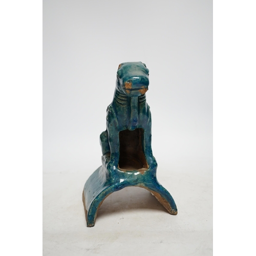 328 - A Chinese turquoise glazed lion-dog ridge tile, Ming dynasty, 22cm high