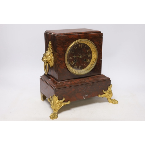 339 - A late 19th century French rouge marble and ormolu clock garniture, 31cm