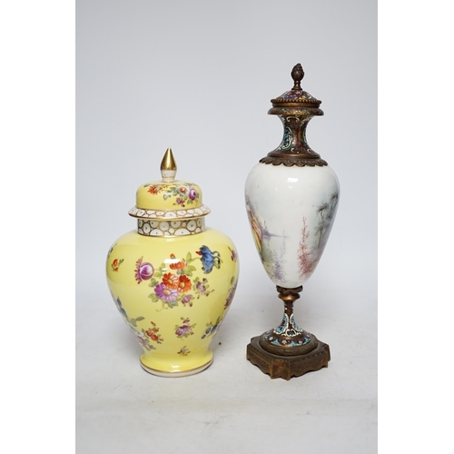 369 - A 19th century French ormolu, enamel and porcelain urn and cover and a Dresden yellow urn and cover,... 