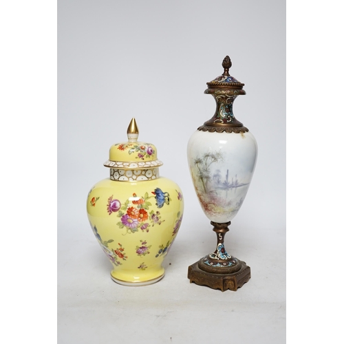 369 - A 19th century French ormolu, enamel and porcelain urn and cover and a Dresden yellow urn and cover,... 