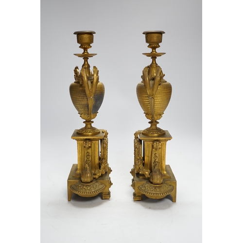 391 - A pair of 19th century French ornamental gilt metal candlesticks, possibly clock garnitures, 32.5cm ... 