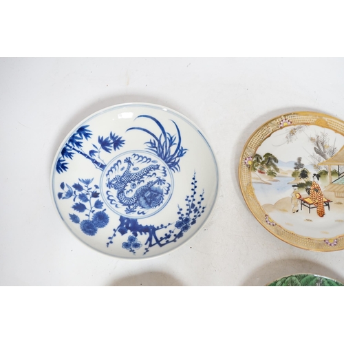 392 - Four Chinese or Japanese porcelain saucers, largest 16.5 cm diameter