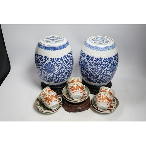 400 - A pair of Chinese blue and white barrel jars, various cups and saucers and three hardwood stands, la... 