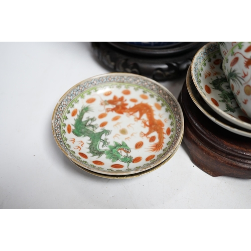 400 - A pair of Chinese blue and white barrel jars, various cups and saucers and three hardwood stands, la... 