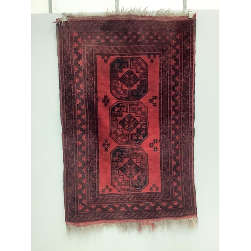 51 - Two Afghan red ground rugs, larger 170 x 120cm