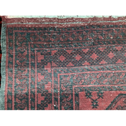 51 - Two Afghan red ground rugs, larger 170 x 120cm