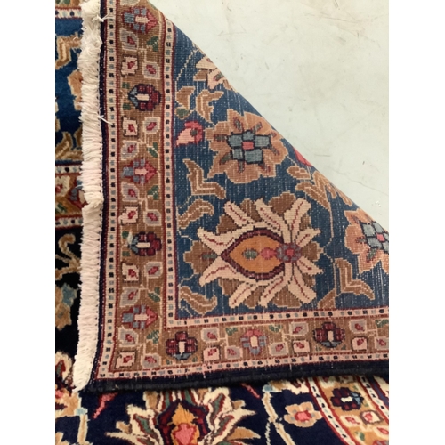 96 - A Kashan blue ground carpet, 290 x 195cm