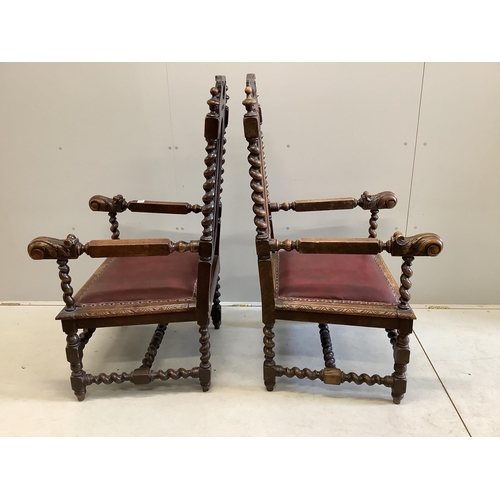 1018 - A pair of late Victorian carved oak elbow chairs, width 69cm, depth 63cm, height 122cm