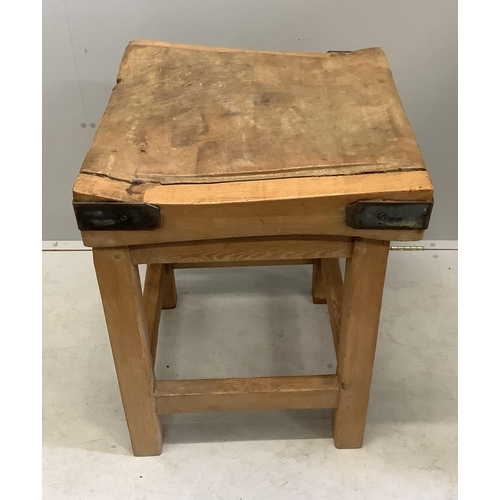 1031 - A Victorian iron bound butcher's block on pine stand, width 60cm, depth 61cm, height 81cm