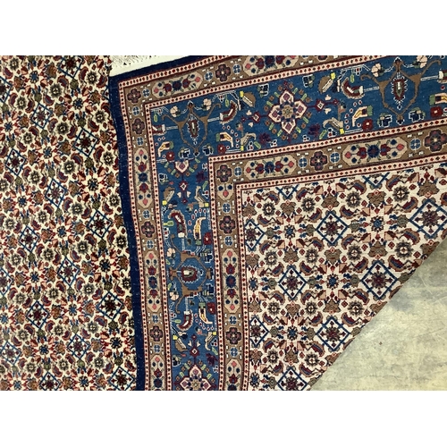 1032 - A North West Persian ivory ground carpet, 275 x 210cm