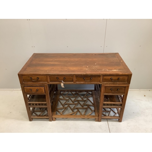 1043 - A Chinese elm pedestal desk, width 138cm, depth 68cm, height 83cm