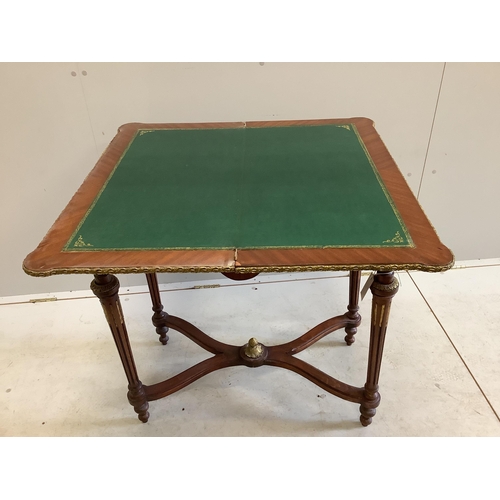 1053 - A Louis XVI style gilt metal mounted and marquetry inlaid folding card table, width 77cm, depth 40cm... 