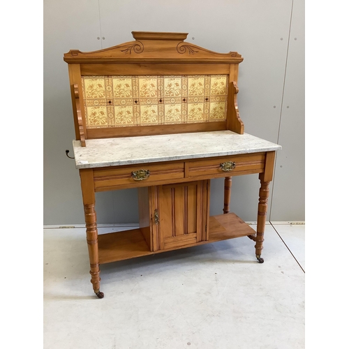 1063 - A late Victorian satin walnut tiled back marble top washstand, width 106cm, depth 52cm, height 133cm... 