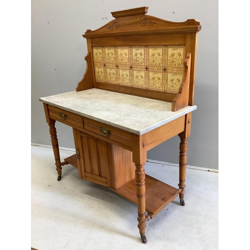 1063 - A late Victorian satin walnut tiled back marble top washstand, width 106cm, depth 52cm, height 133cm... 