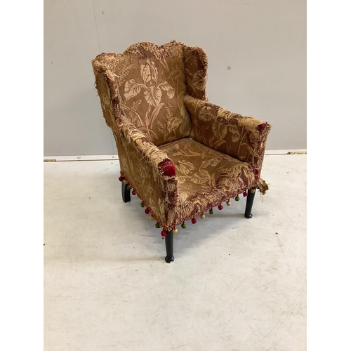 1064 - A late 19th century upholstered child's wing armchair, width 46cm, depth 45cm, height 60cm