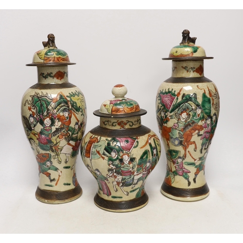 1382 - Three various Chinese crackleware famille rose jars and covers including a baluster example, largest... 