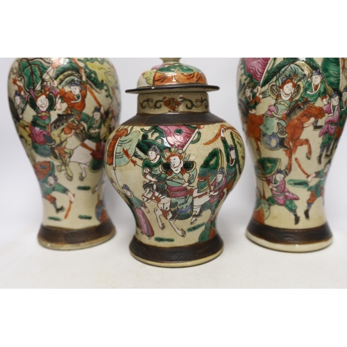 1382 - Three various Chinese crackleware famille rose jars and covers including a baluster example, largest... 