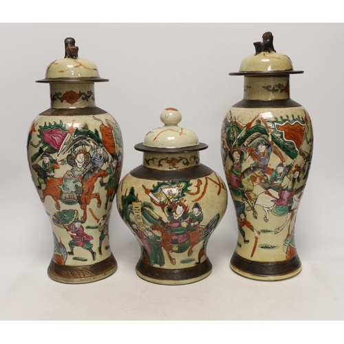 1382 - Three various Chinese crackleware famille rose jars and covers including a baluster example, largest... 