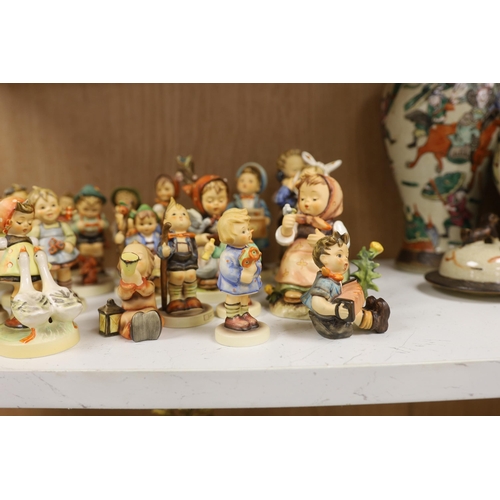 1383 - Twenty eight Goebel Hummel figures, largest 15cm high