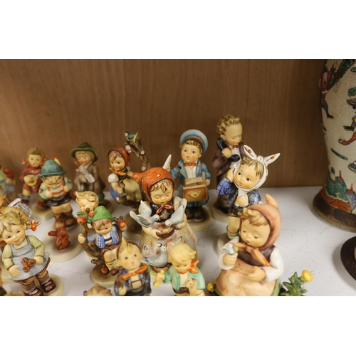 1383 - Twenty eight Goebel Hummel figures, largest 15cm high