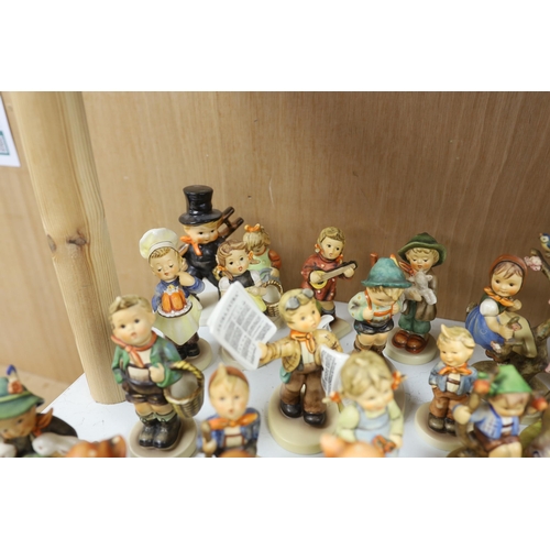 1383 - Twenty eight Goebel Hummel figures, largest 15cm high