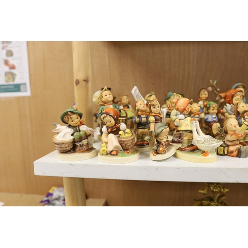 1383 - Twenty eight Goebel Hummel figures, largest 15cm high