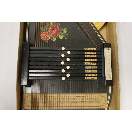 1386 - An autoharp in original box with booklet