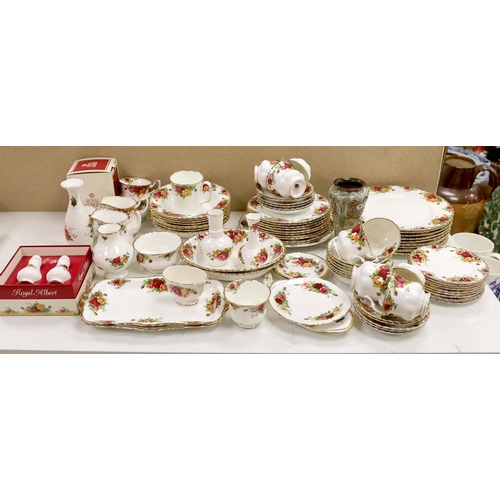 1398 - A Royal Albert Old Crown Roses dinner and tea service and a Doulton Lambeth vase