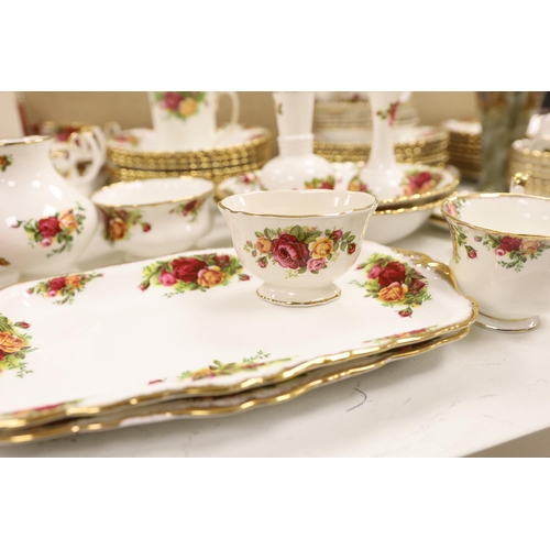 1398 - A Royal Albert Old Crown Roses dinner and tea service and a Doulton Lambeth vase