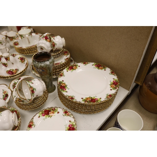 1398 - A Royal Albert Old Crown Roses dinner and tea service and a Doulton Lambeth vase