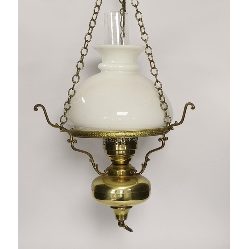 1404 - A pair of brass hanging lights with opaque glass shades