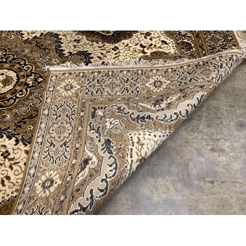 100 - A machined Persian style ivory ground carpet, 330cm x 250cm