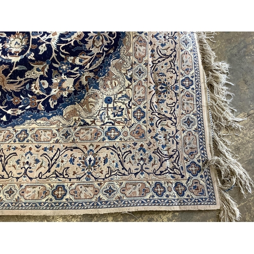 168 - A North West Persian blue ground carpet, 260 x 168cm