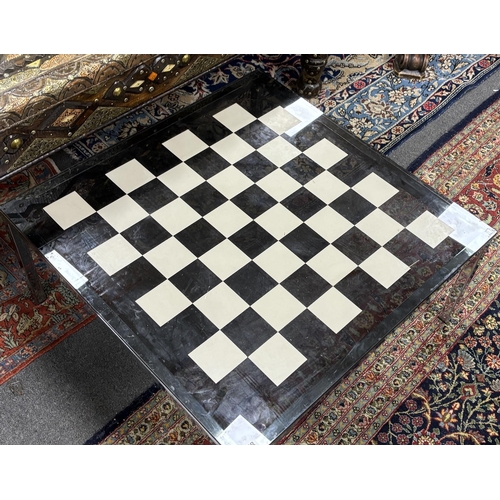 178 - A 20th century square glass and chrome low games table, width 74cm, height 35cm