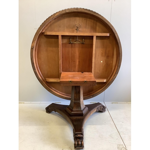 179 - A William IV circular rosewood centre table, the tilt top with lappet carved edge on single tapered ... 