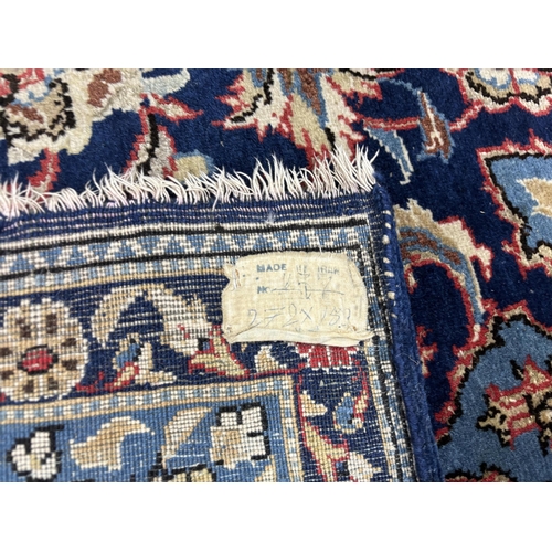 180 - A North West Persian blue ground carpet, 270 x 158cm