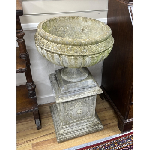 197 - A set of three circular reconstituted stone garden urns on square plinths, diameter 54cm, height 95c... 