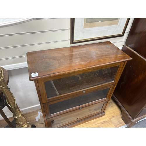 203 - A glazed mahogany three door bookcase, width 82cm, depth 34cm, height 99cm